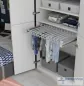 Preview: Kleiderbügelauszug für Hosen und Röcke. Montage unter einem Einlegboden, Breite verstellbar.